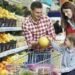 Family with child shopping fruits